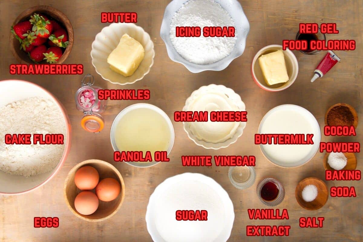 Valentine's Day cake ingredients prepped and labeled on brown background.