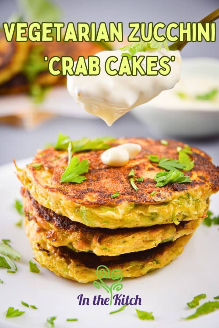 Zucchini crab cakes stacked on top of each other with text overlay that says 'Vegetarian zucchini crab cakes'.