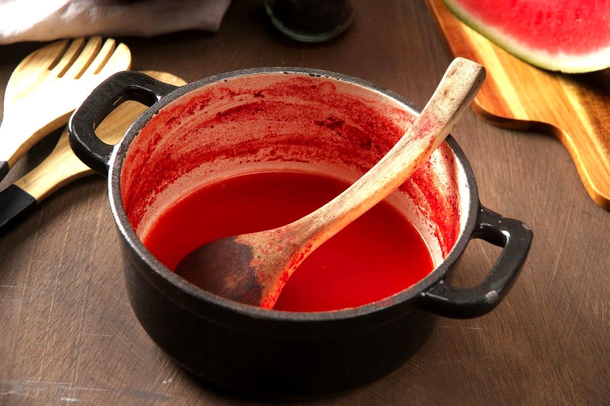 Watermelon reduction in saucepan.