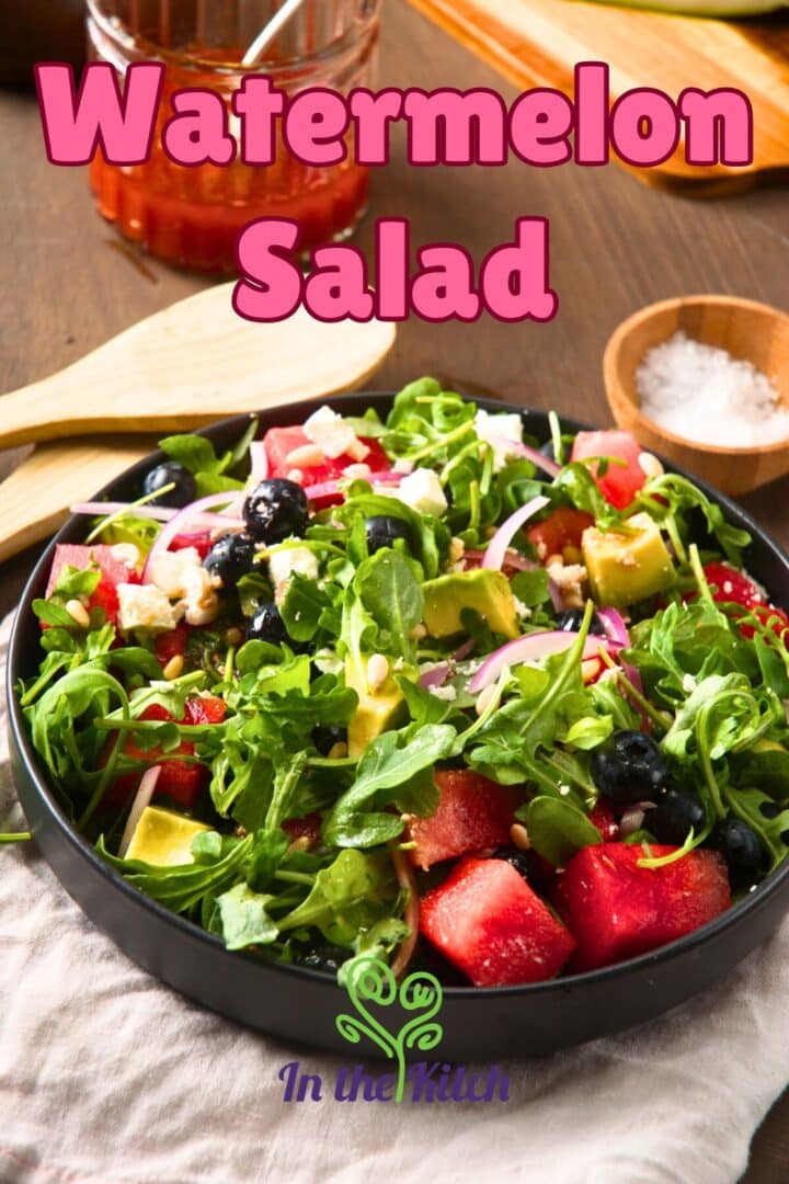 Watermelon salad in black bowl with text overlay that says 'watermelon salad'.
