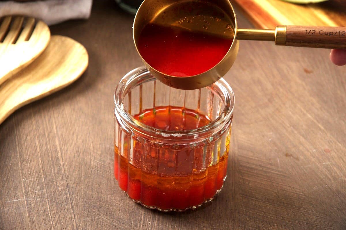 Watermelon salad dressing/vinaigrette in jar.