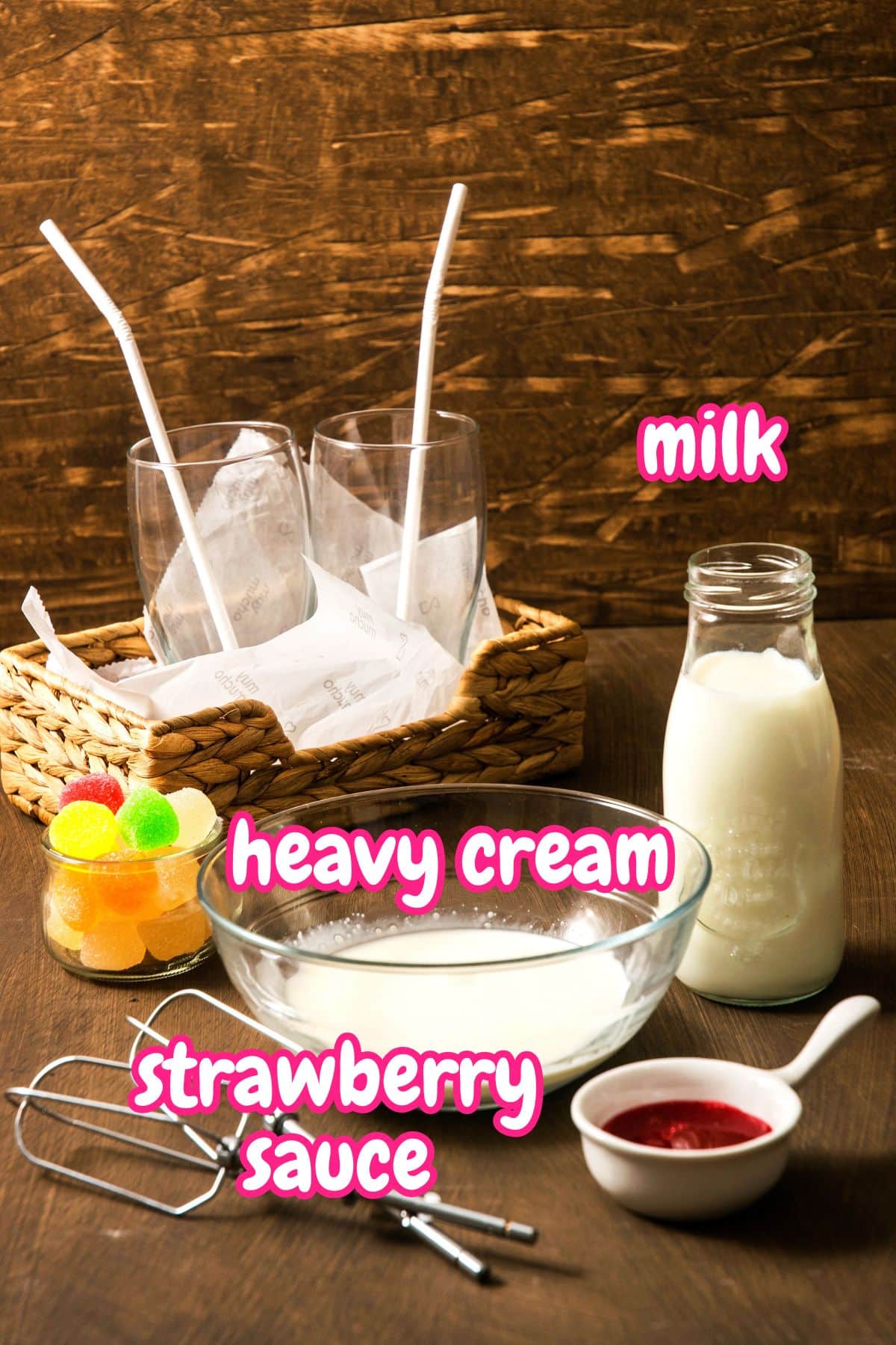 Whipped strawberry milk ingredients labeled on brown background.