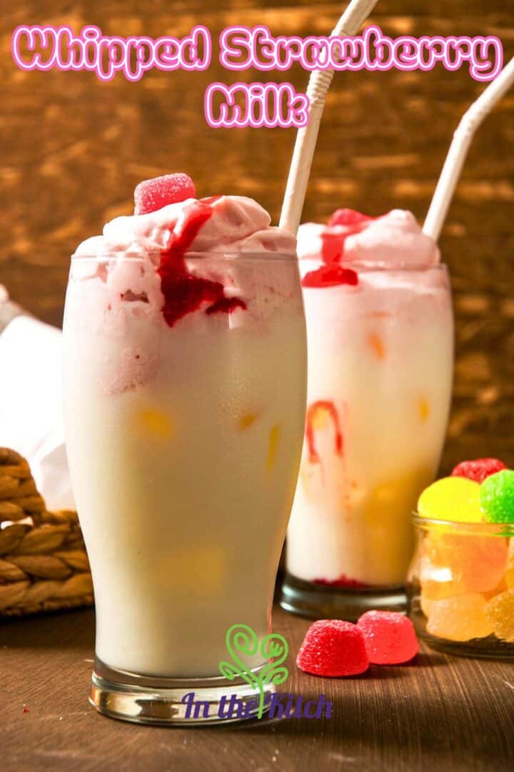 2 glasses filled with whipped strawberry milk and text overlay that says 'Whipped Strawberry Milk'.