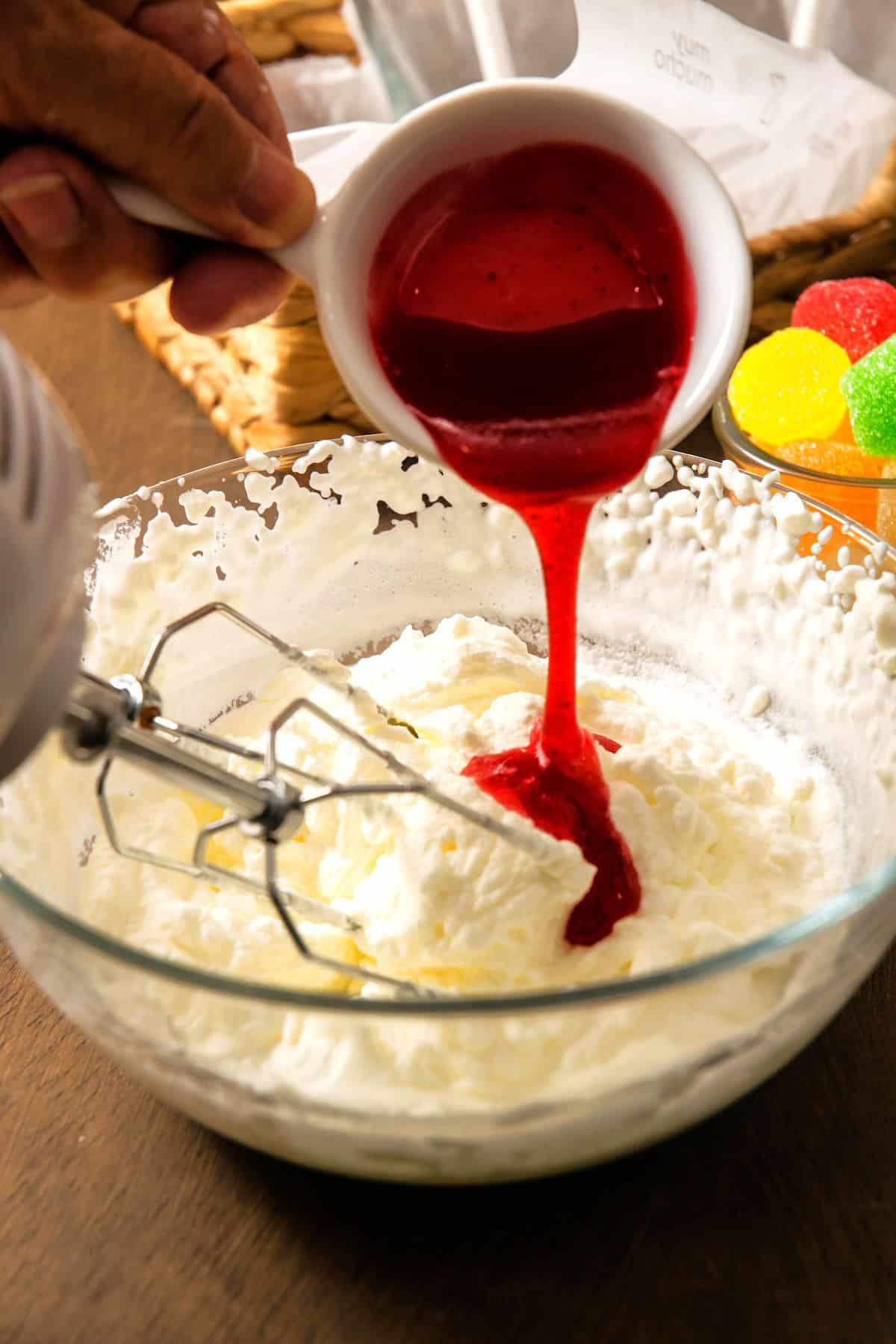 Strawberry sauce and whipped cream in bowl.