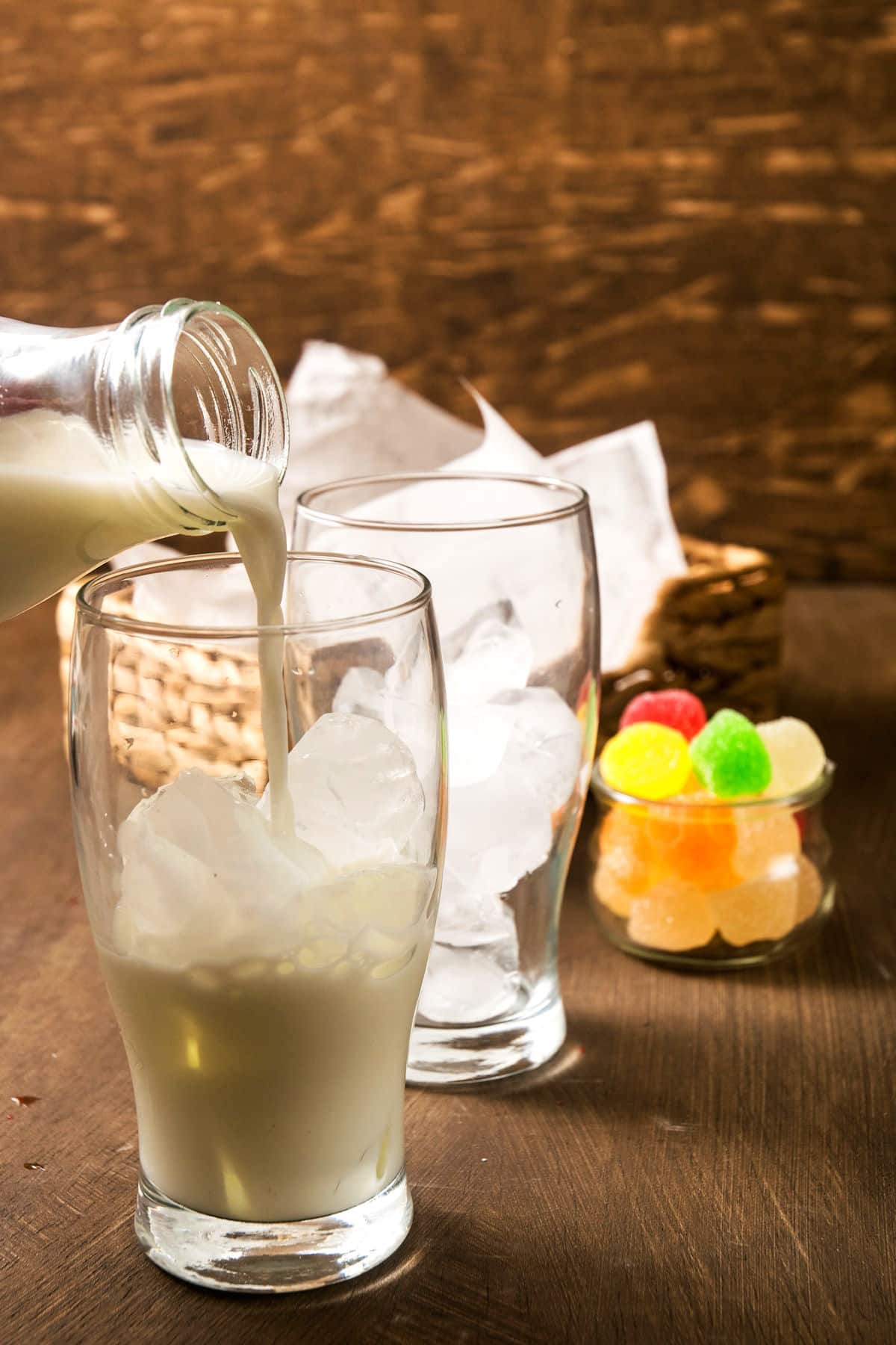 Milk over ice in glass.